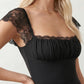 Women's Soraia Lace Lace-Up Mini Dress featuring elegant floral lace, a square neckline with a ruched bust, scalloped cap sleeves, a corset-style lace-up back, and a flattering A-line mini skirt finished with a scalloped lace hem, perfect for weddings, race days, garden parties and special occasions.