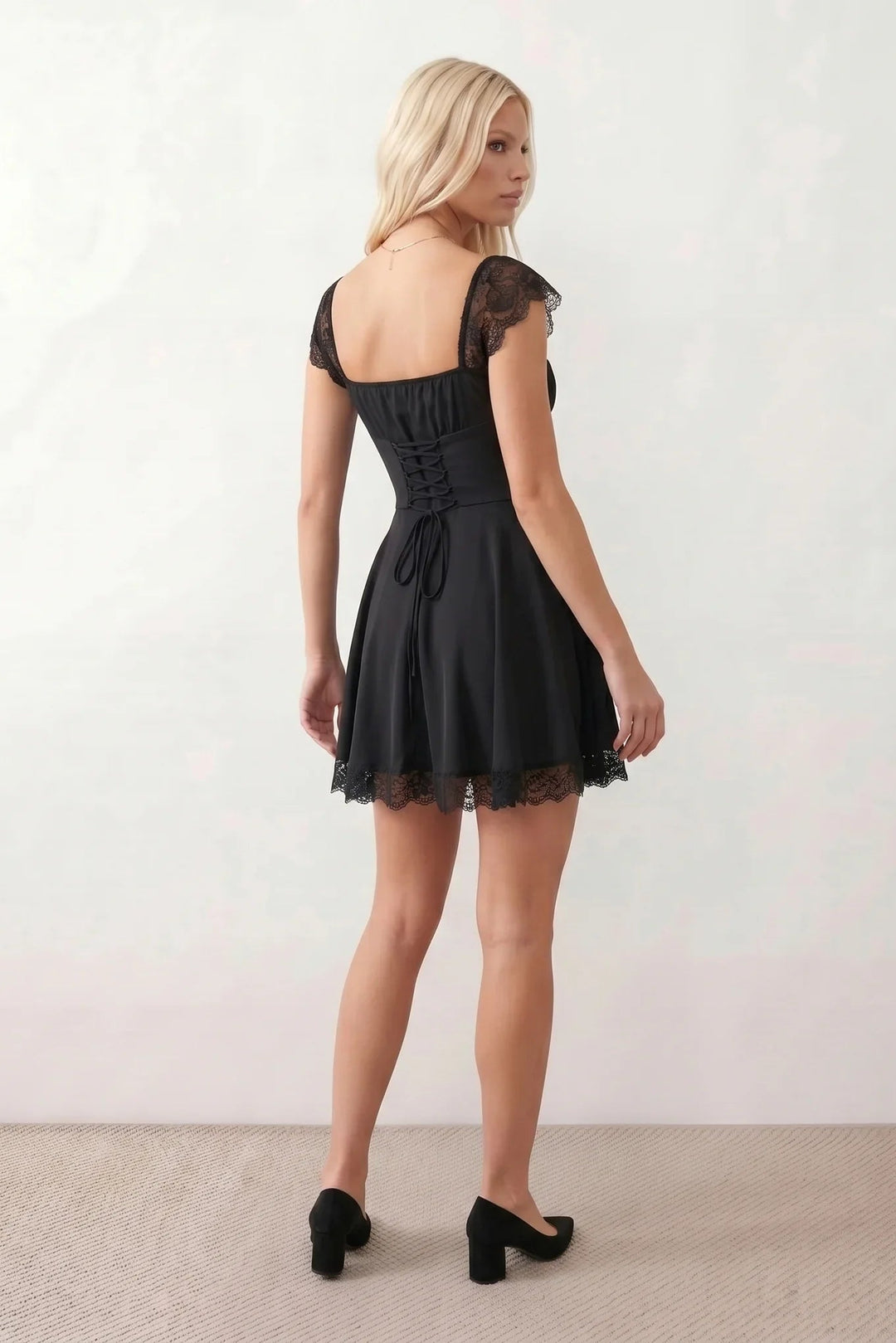 Women's Soraia Lace Lace-Up Mini Dress featuring elegant floral lace, a square neckline with a ruched bust, scalloped cap sleeves, a corset-style lace-up back, and a flattering A-line mini skirt finished with a scalloped lace hem, perfect for weddings, race days, garden parties and special occasions.