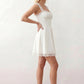 Women's Soraia Lace Lace-Up Mini Dress featuring elegant floral lace, a square neckline with a ruched bust, scalloped cap sleeves, a corset-style lace-up back, and a flattering A-line mini skirt finished with a scalloped lace hem, perfect for weddings, race days, garden parties and special occasions.