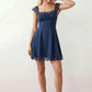 Women's Soraia Lace Lace-Up Mini Dress featuring elegant floral lace, a square neckline with a ruched bust, scalloped cap sleeves, a corset-style lace-up back, and a flattering A-line mini skirt finished with a scalloped lace hem, perfect for weddings, race days, garden parties and special occasions.