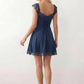 Women's Soraia Lace Lace-Up Mini Dress featuring elegant floral lace, a square neckline with a ruched bust, scalloped cap sleeves, a corset-style lace-up back, and a flattering A-line mini skirt finished with a scalloped lace hem, perfect for weddings, race days, garden parties and special occasions.