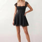 Women's Soraia Lace Lace-Up Mini Dress featuring elegant floral lace, a square neckline with a ruched bust, scalloped cap sleeves, a corset-style lace-up back, and a flattering A-line mini skirt finished with a scalloped lace hem, perfect for weddings, race days, garden parties and special occasions.
