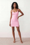 Woman wearing the spaghetti strap low back fitted mini dress featuring adjustable straps, a figure-hugging sheath silhouette, elegant low open back, side slit, and mini-length hem, perfect for parties, weddings, and evening occasions.