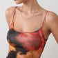 Women's spaghetti strap floral maxi dress with a fitted sheath silhouette, round neckline, adjustable straps, and elegant low open back in a red and black floral print, perfect for weddings and special occasions.