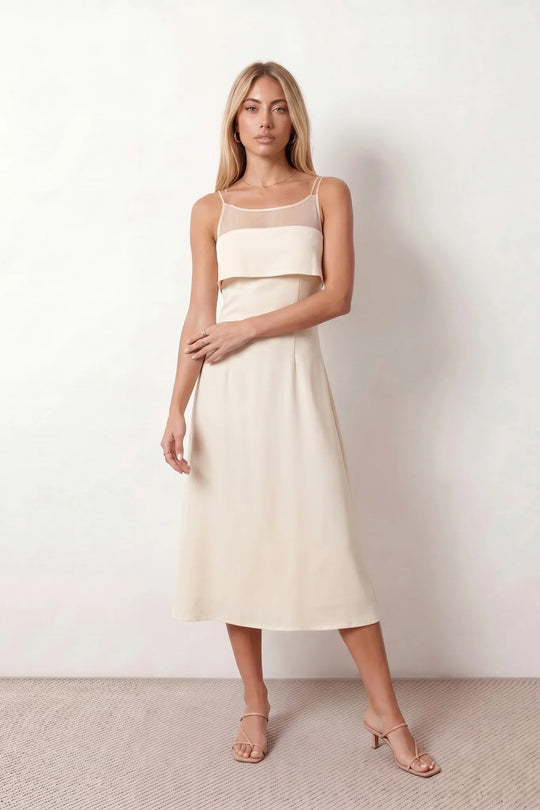 Women's spaghetti strap A-line midi dress with a sheer mesh bodice panel, delicate ruffle detail, fitted waist, and flowing midi skirt, ideal for weddings, race days, and elegant occasion wear.