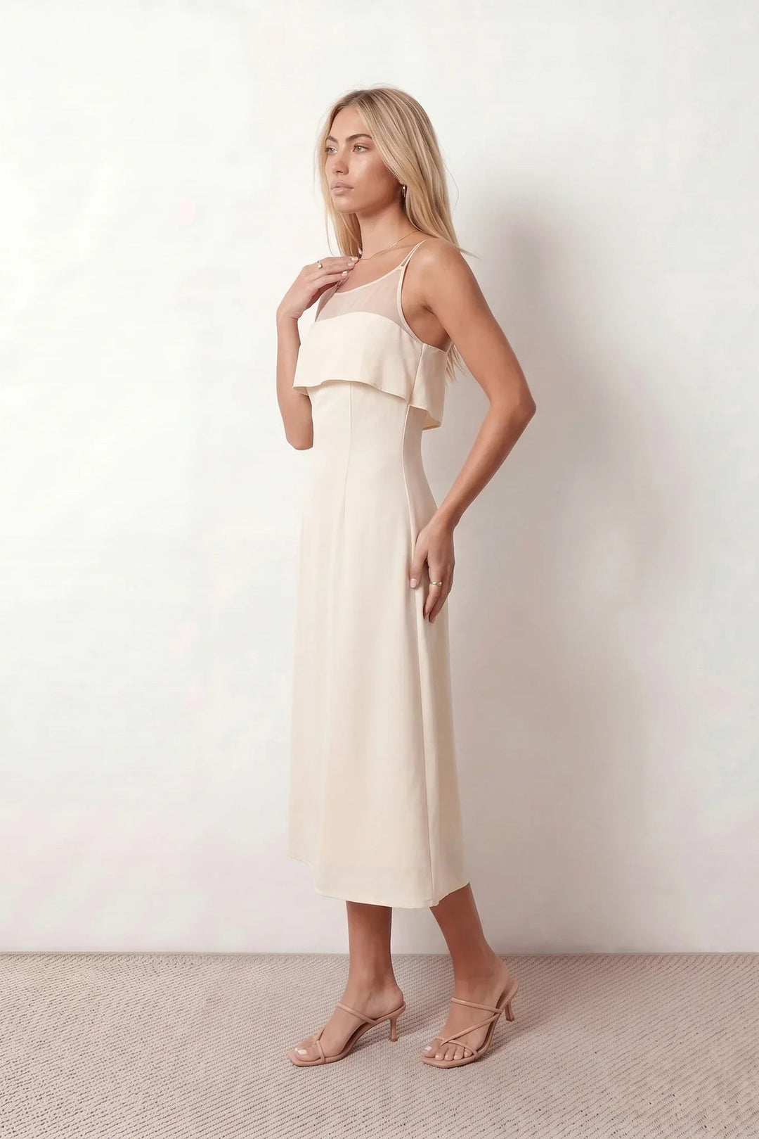 Women's spaghetti strap A-line midi dress with a sheer mesh bodice panel, delicate ruffle detail, fitted waist, and flowing midi skirt, ideal for weddings, race days, and elegant occasion wear.