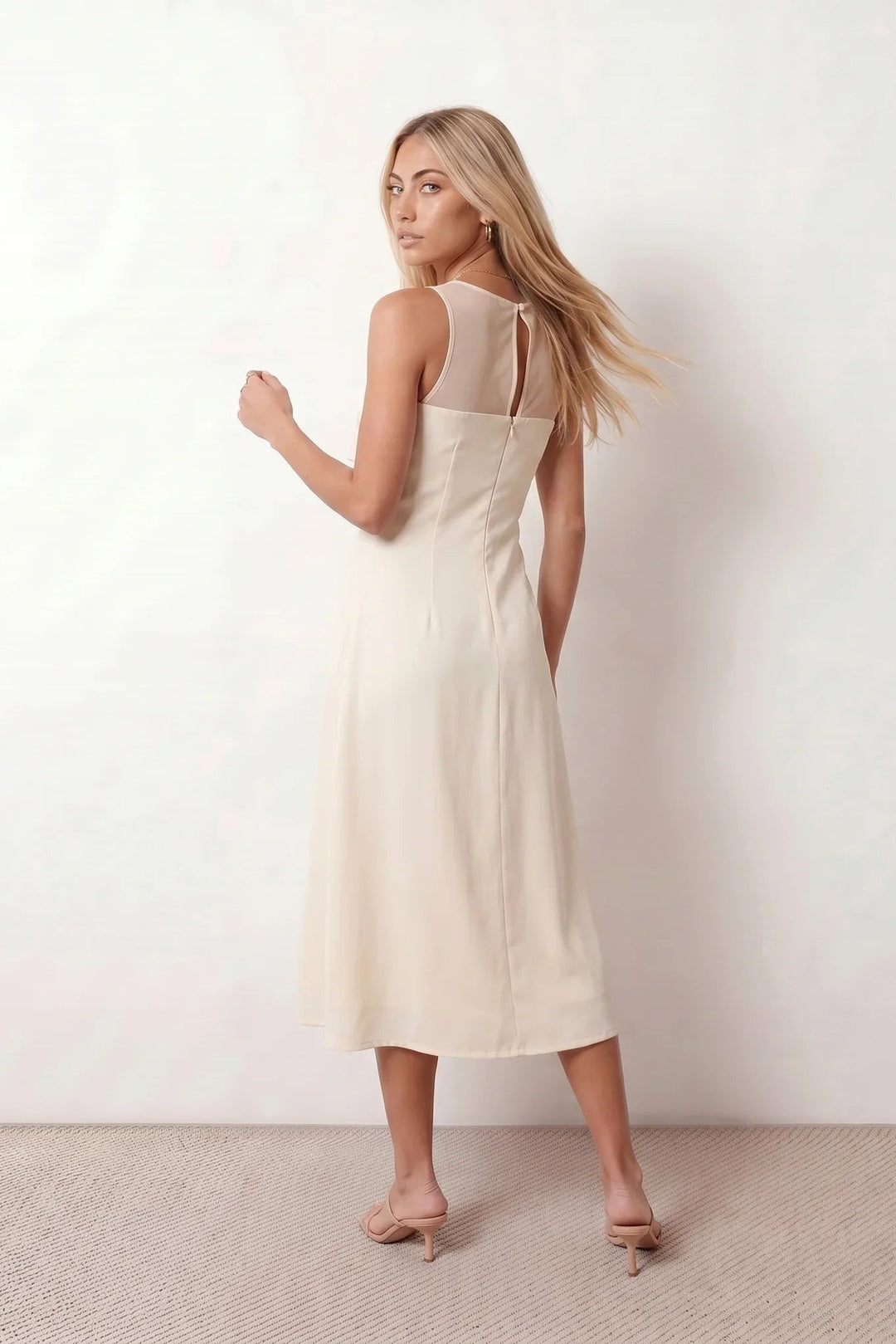 Women's spaghetti strap A-line midi dress with a sheer mesh bodice panel, delicate ruffle detail, fitted waist, and flowing midi skirt, ideal for weddings, race days, and elegant occasion wear.