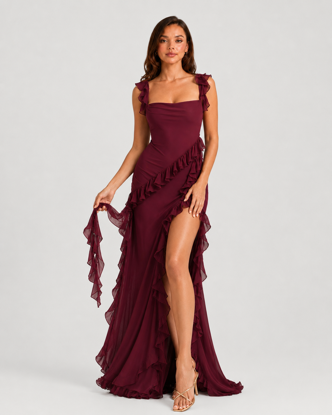 Women's elegant summer occasion dress with sculpted fit, flowing skirt, and sophisticated split detail for refined event styling.