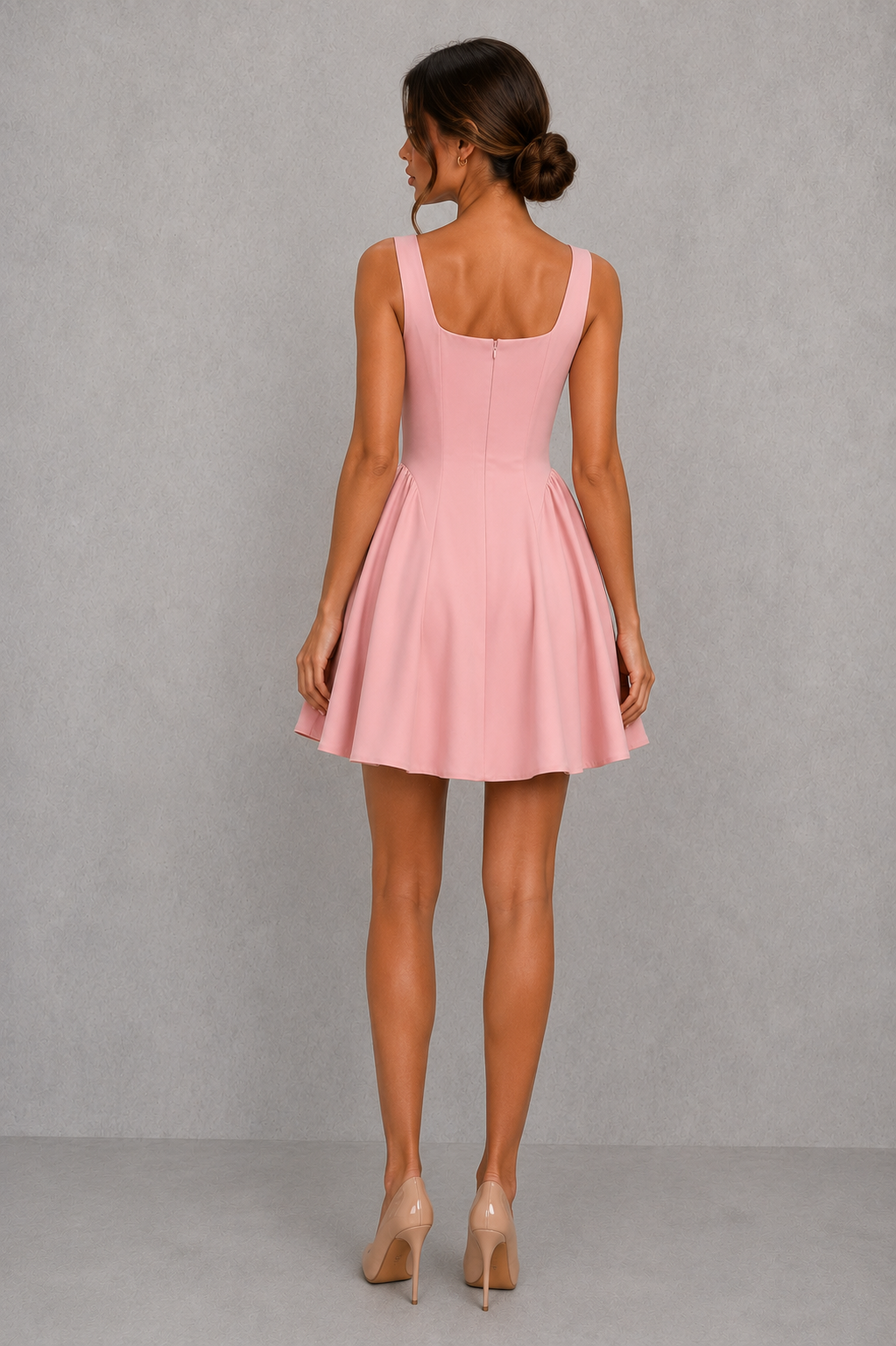 Women’s square neck pleated mini dress featuring delicate shoulder straps, a fitted bodice, and a flowing A-line skirt in soft pale pink for parties and special occasions.
