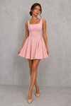 Women’s square neck pleated mini dress featuring delicate shoulder straps, a fitted bodice, and a flowing A-line skirt in soft pale pink for parties and special occasions.