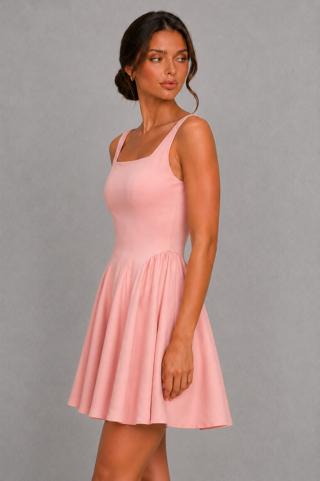 Women’s square neck pleated mini dress featuring delicate shoulder straps, a fitted bodice, and a flowing A-line skirt in soft pale pink for parties and special occasions.
