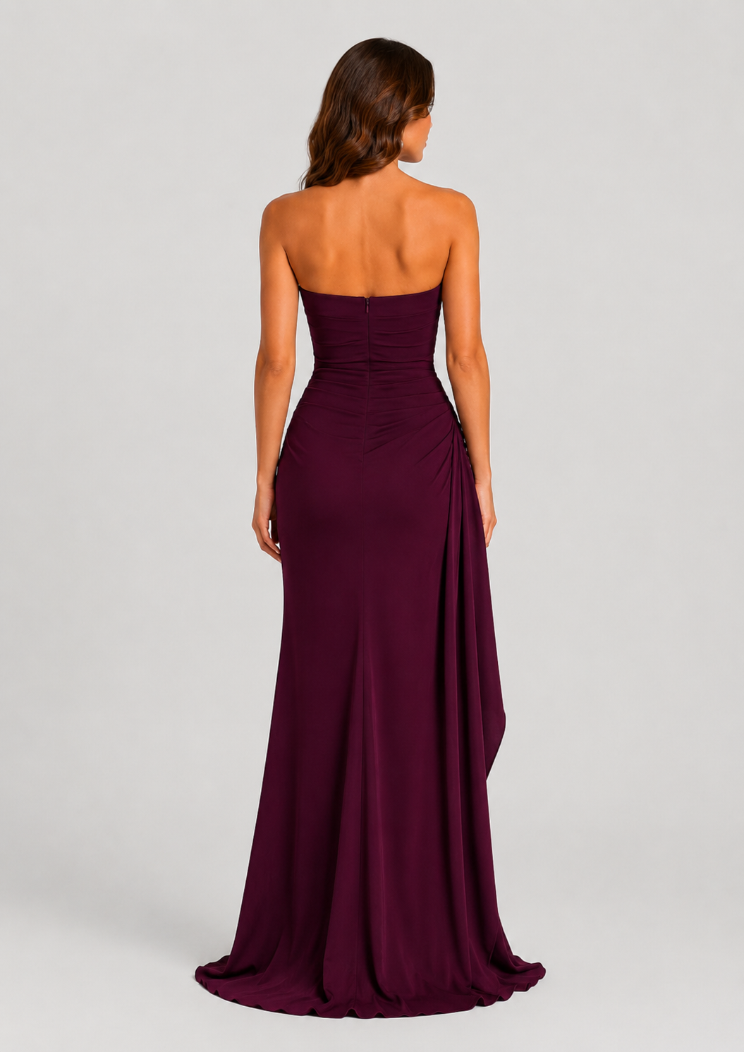 Women's strapless ruched maxi dress in double stretch crepe featuring a figure-hugging silhouette, thigh-high split, and cascading drape ruffle detail.