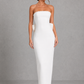 Women's strapless pearl trim maxi dress in premium crepe with a fitted bodice, elegant column skirt, centre back split, and detachable oversized bow for formal occasions.
