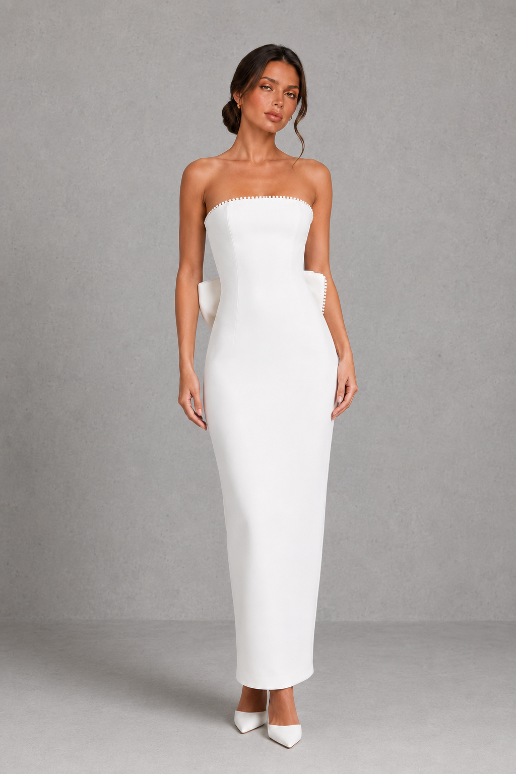 Women's strapless pearl trim maxi dress in premium crepe with a fitted bodice, elegant column skirt, centre back split, and detachable oversized bow for formal occasions.