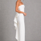 Women's strapless pearl trim maxi dress in premium crepe with a fitted bodice, elegant column skirt, centre back split, and detachable oversized bow for formal occasions.
