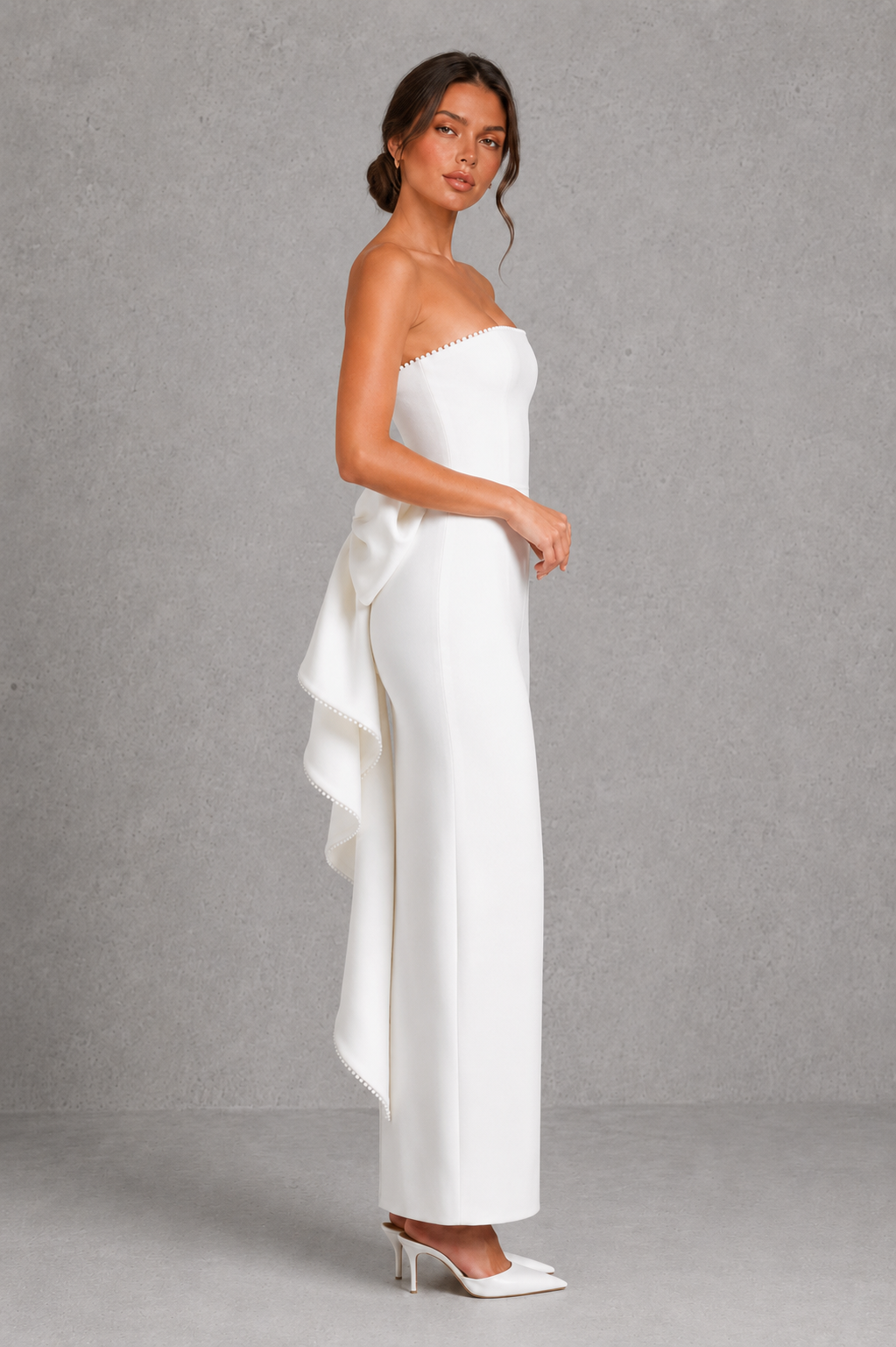Women's strapless pearl trim maxi dress in premium crepe with a fitted bodice, elegant column skirt, centre back split, and detachable oversized bow for formal occasions.