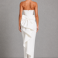 Women's strapless pearl trim maxi dress in premium crepe with a fitted bodice, elegant column skirt, centre back split, and detachable oversized bow for formal occasions.