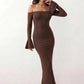 Woman wearing the strapless mermaid maxi dress with a sweetheart neckline, statement shoulder bow, matching long bell-cuff gloves, fitted silhouette and floor-length hem, ideal for weddings, black-tie events and formal occasions.