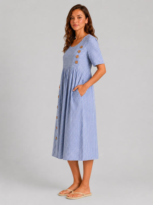 Women's striped midi dress featuring side button detailing, relaxed A-line silhouette, lightweight fabric, and practical side pockets for effortless everyday style.