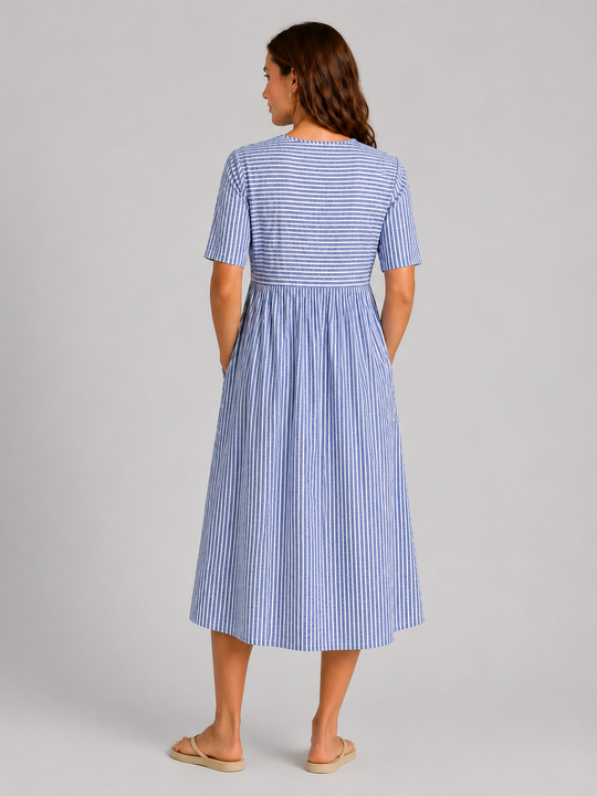 Women's striped midi dress featuring side button detailing, relaxed A-line silhouette, lightweight fabric, and practical side pockets for effortless everyday style.