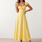 Halle sweetheart low back maxi dress with a structured corset bodice, tie-front bust detail, sweetheart neckline, low open back, and flowing A-line maxi skirt with a floor-length hem.