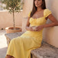 Halle sweetheart low back maxi dress with a structured corset bodice, tie-front bust detail, sweetheart neckline, low open back, and flowing A-line maxi skirt with a floor-length hem.