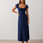 Halle sweetheart low back maxi dress with a structured corset bodice, tie-front bust detail, sweetheart neckline, low open back, and flowing A-line maxi skirt with a floor-length hem.