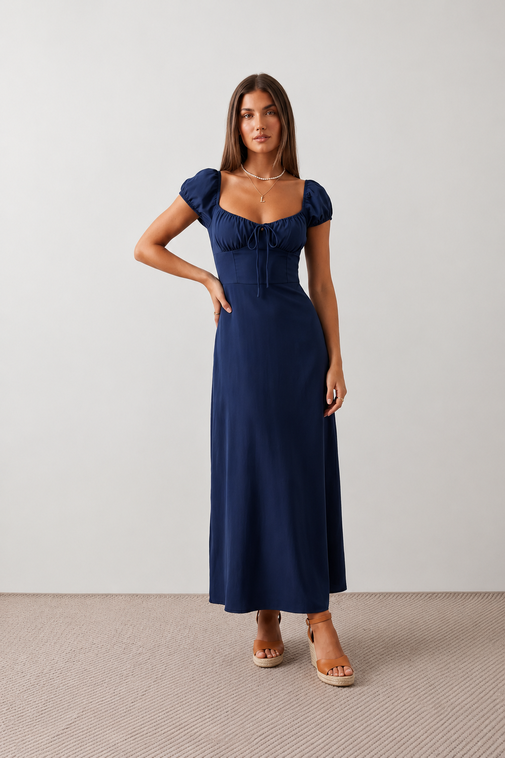 Halle sweetheart low back maxi dress with a structured corset bodice, tie-front bust detail, sweetheart neckline, low open back, and flowing A-line maxi skirt with a floor-length hem.