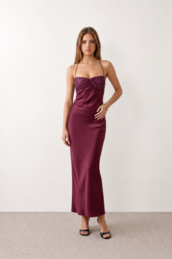 Women's Sylvie sequined slip maxi dress featuring a sparkling sweetheart bodice with ruched twist detail, adjustable halter tie neckline, lace-up open back, satin floor-length skirt with a side split, perfect for weddings, black-tie events and formal evening occasions.