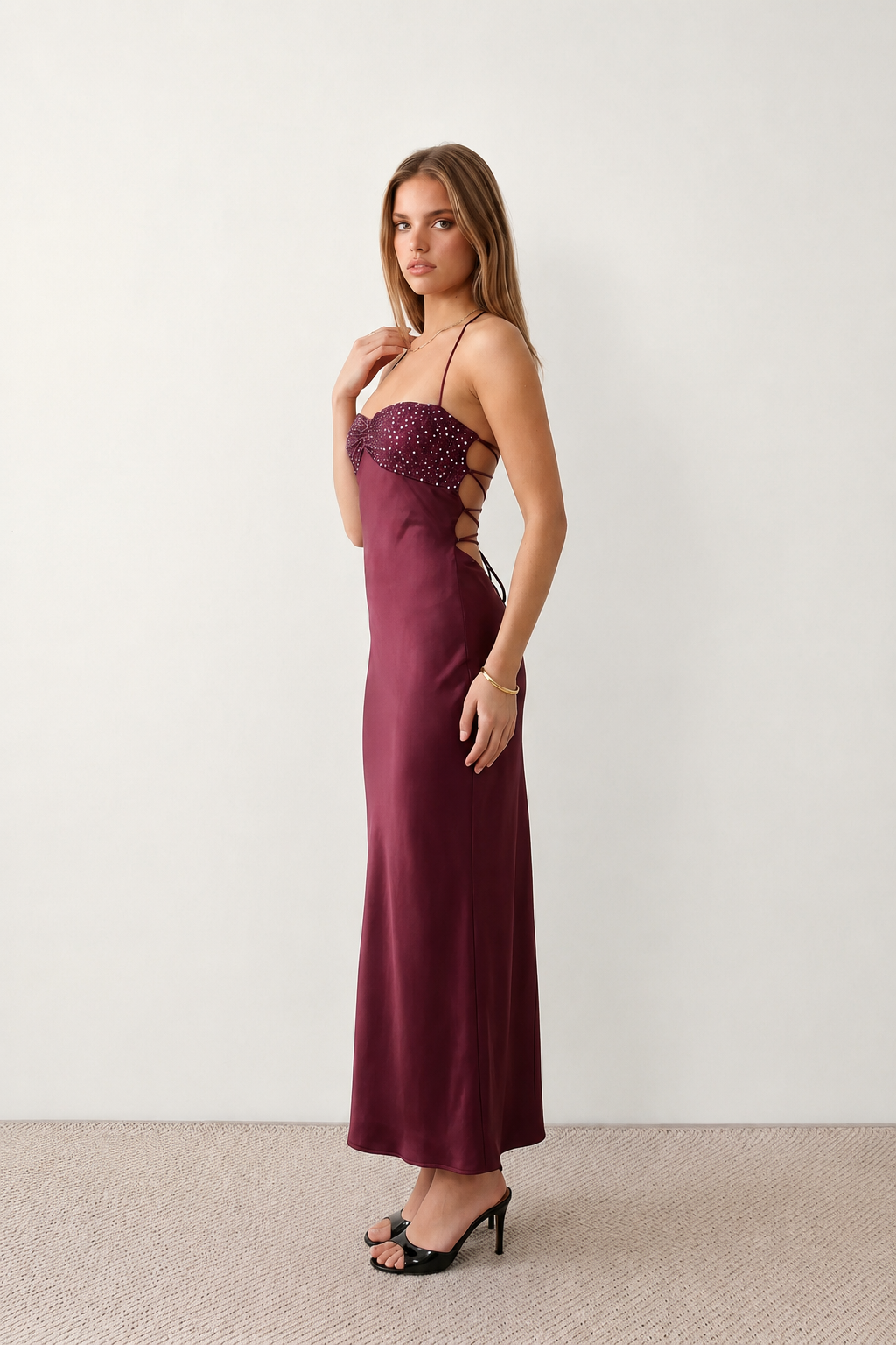 Women's Sylvie sequined slip maxi dress featuring a sparkling sweetheart bodice with ruched twist detail, adjustable halter tie neckline, lace-up open back, satin floor-length skirt with a side split, perfect for weddings, black-tie events and formal evening occasions.