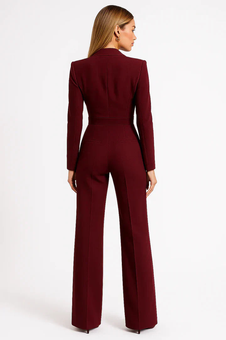 Burgundy jumpsuit worn by a model on a white background