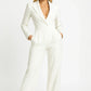 Woman wearing a white jumpsuit on a white background