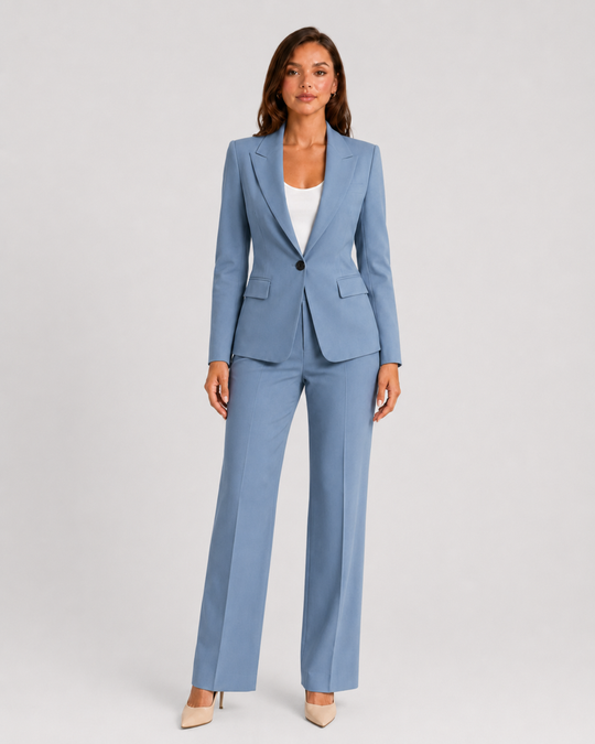 Woman wearing a tailored blazer and high-waist trousers set featuring a structured silhouette, clean lines, and sophisticated modern tailoring.