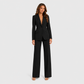 Women's tailored blazer and wide-leg trouser co-ord set featuring a structured notched lapel blazer and fluid wide-leg trousers in a refined neutral tone.