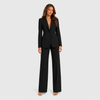 Women's tailored blazer and wide-leg trouser co-ord set featuring a structured notched lapel blazer and fluid wide-leg trousers in a refined neutral tone.