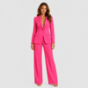 Women's tailored blazer and wide-leg trouser co-ord set featuring a structured notched lapel blazer and fluid wide-leg trousers in a refined neutral tone.