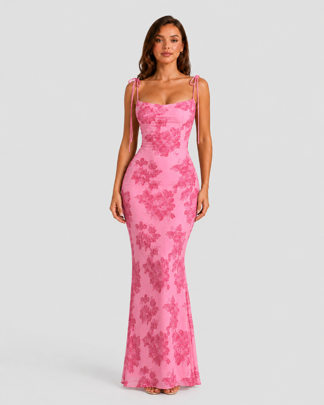 Women's embroidered floral maxi dress with adjustable tie straps, flowing silhouette, and delicate floral detailing for elegant occasion wear.