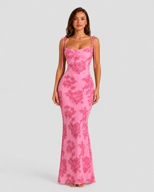 Women's embroidered floral maxi dress with adjustable tie straps, flowing silhouette, and delicate floral detailing for elegant occasion wear.
