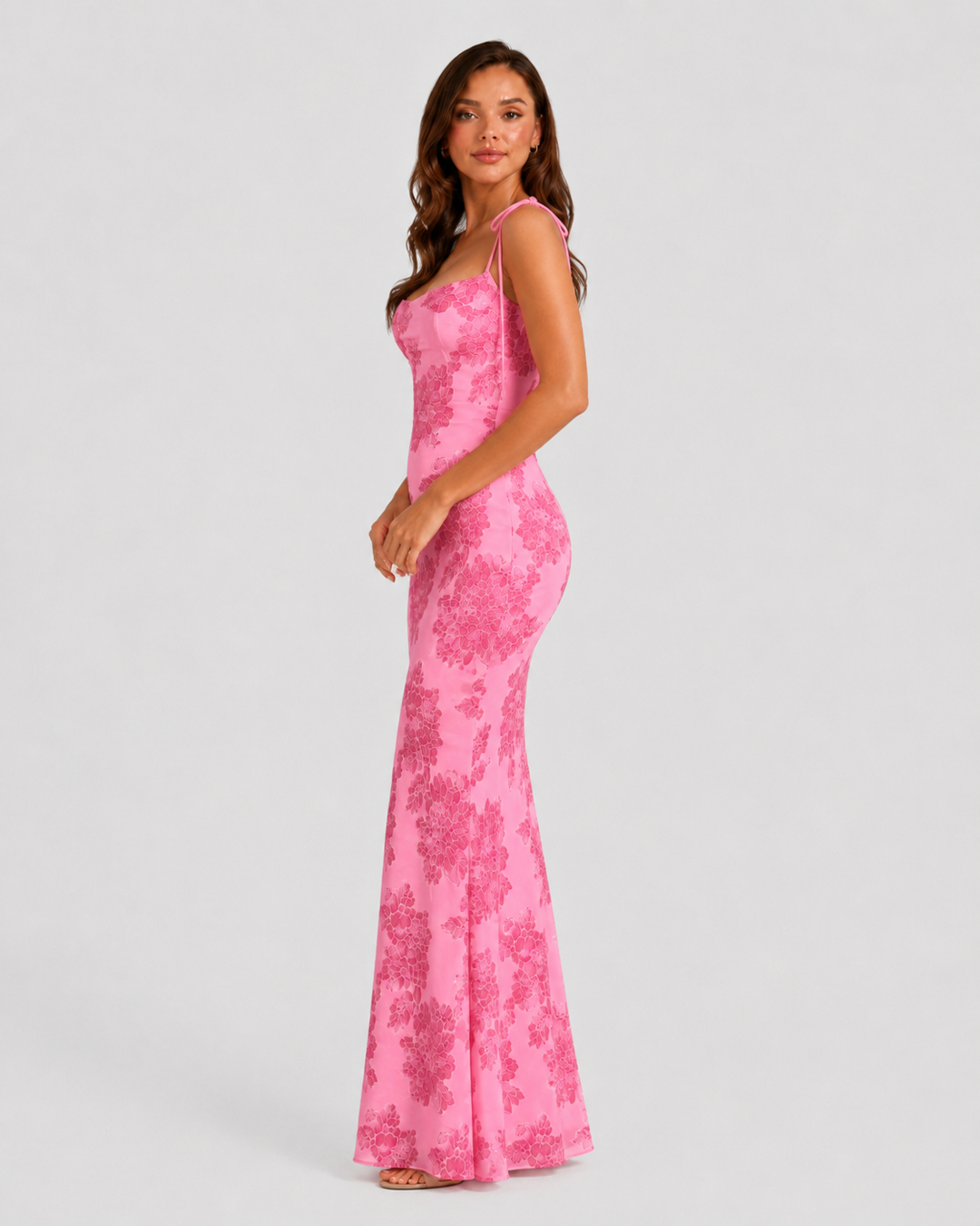 Women's embroidered floral maxi dress with adjustable tie straps, flowing silhouette, and delicate floral detailing for elegant occasion wear.