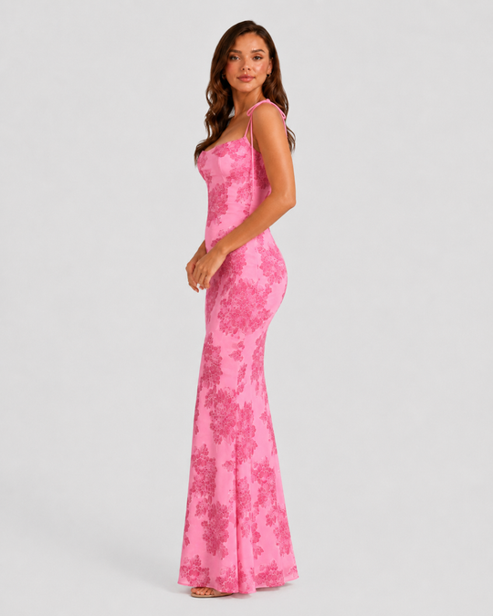 Women's embroidered floral maxi dress with adjustable tie straps, flowing silhouette, and delicate floral detailing for elegant occasion wear.