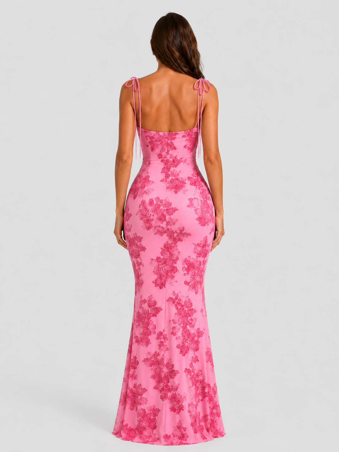 Women's embroidered floral maxi dress with adjustable tie straps, flowing silhouette, and delicate floral detailing for elegant occasion wear.