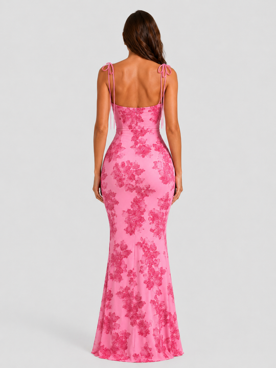 Women's embroidered floral maxi dress with adjustable tie straps, flowing silhouette, and delicate floral detailing for elegant occasion wear.