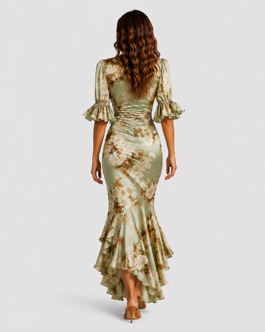 Women's floral satin-feel maxi dress with ruched waist, deep V-neckline, flutter sleeves, and flowing asymmetric hem.