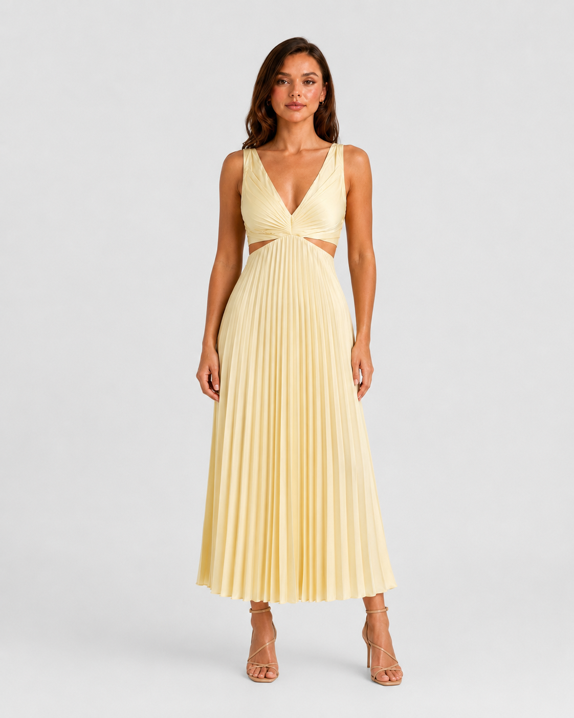 Woman wearing a pleated midi dress with waist cut-outs, gathered V-neck bodice, and flowing skirt designed for elegant occasion dressing.