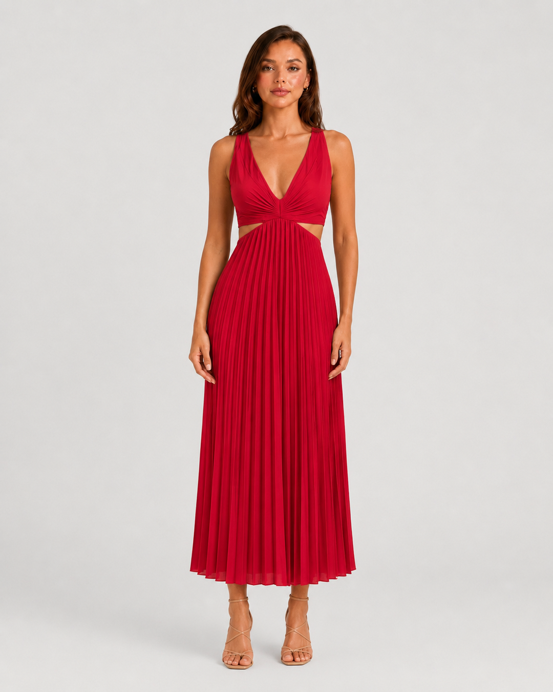 Woman wearing a pleated midi dress with waist cut-outs, gathered V-neck bodice, and flowing skirt designed for elegant occasion dressing.