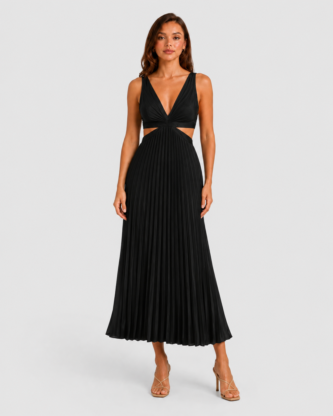 Woman wearing a pleated midi dress with waist cut-outs, gathered V-neck bodice, and flowing skirt designed for elegant occasion dressing.
