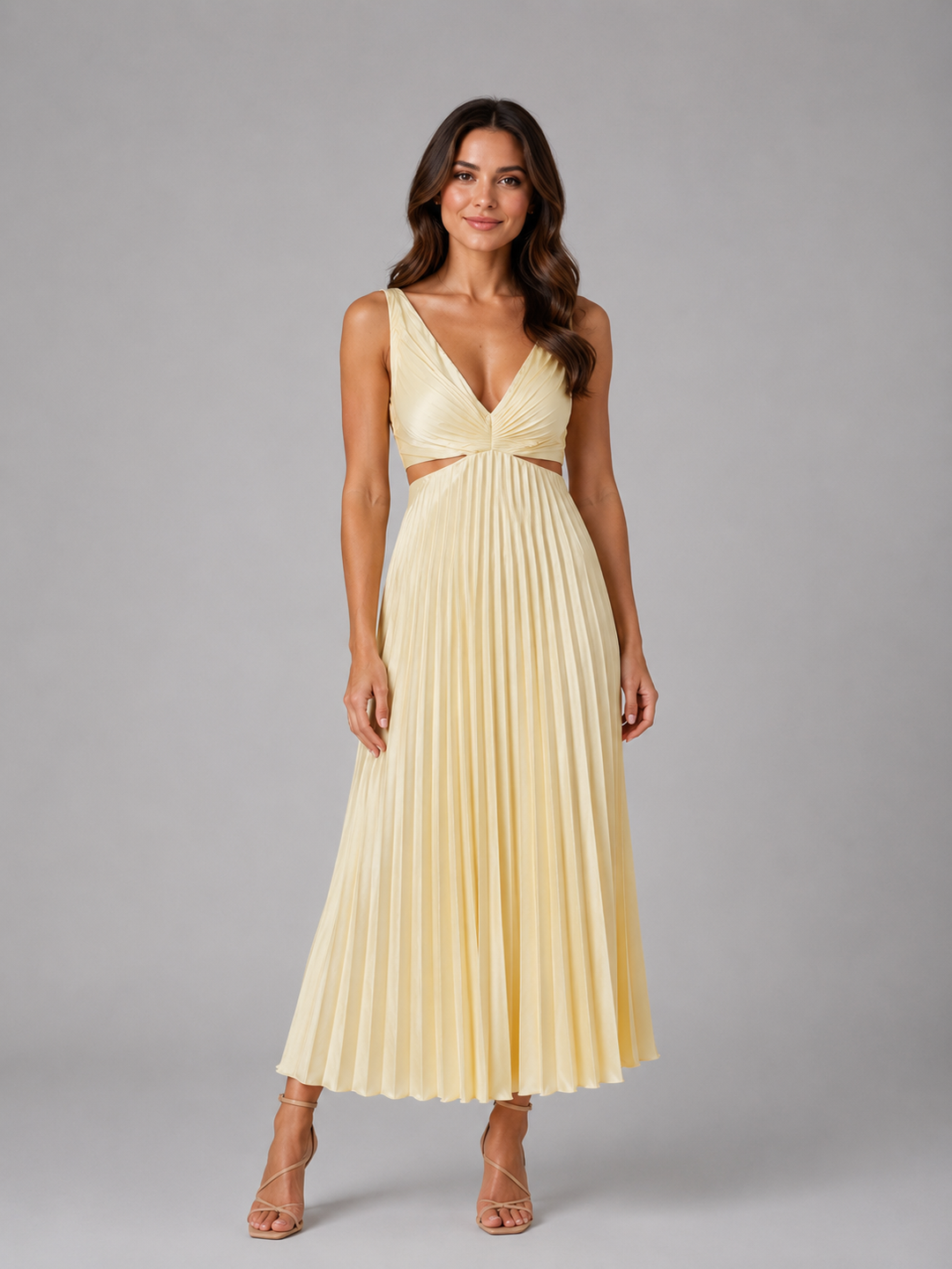 Woman wearing a pleated midi dress with waist cut-outs, gathered V-neck bodice, and flowing skirt designed for elegant occasion dressing.