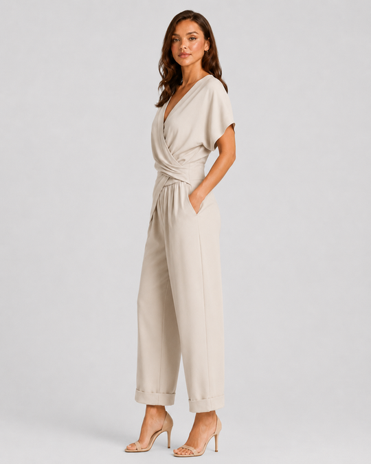 Woman wearing a lightweight wrap front co-ord set with relaxed cropped wide-leg trousers, styled for elegant summer occasions and holiday wear.