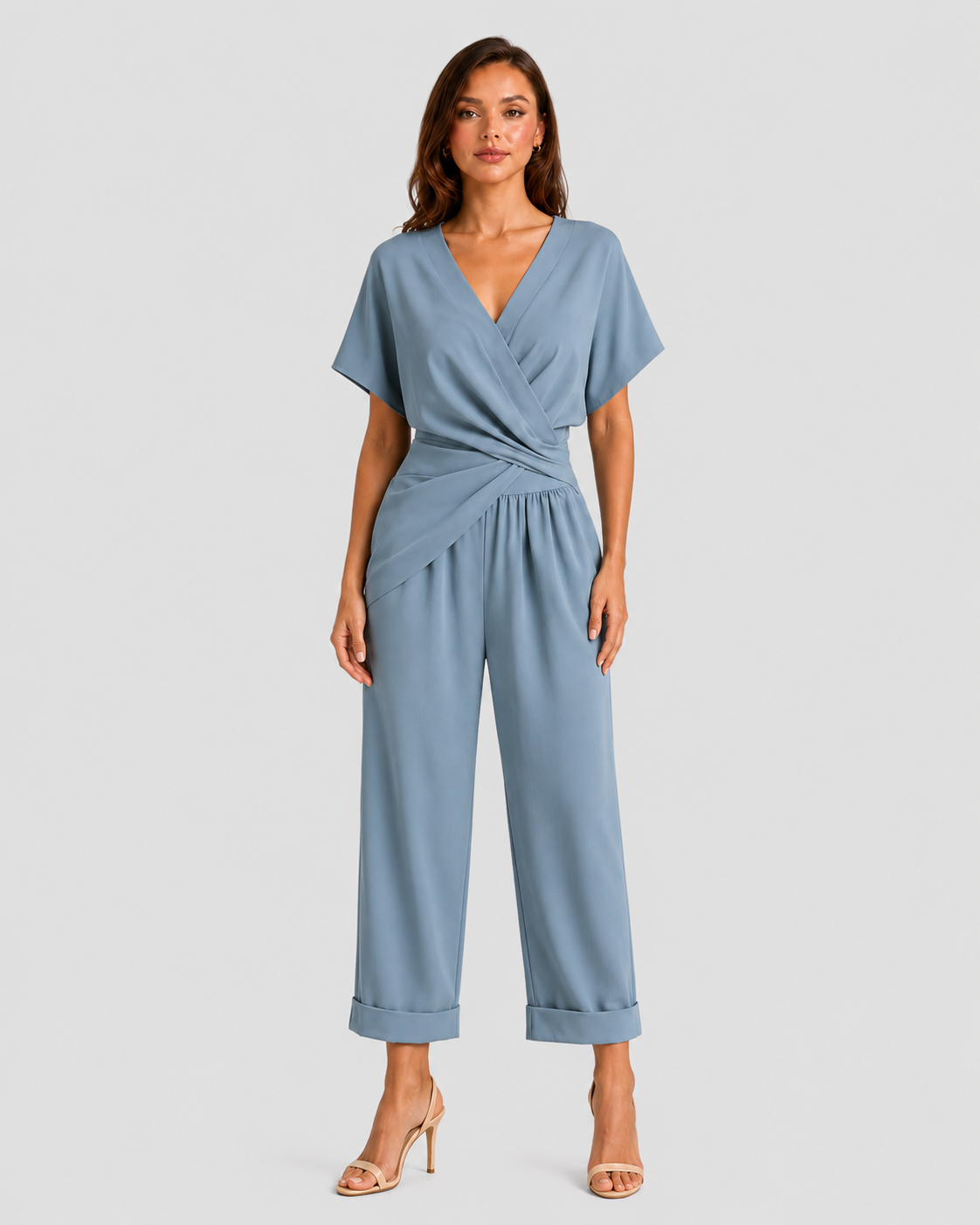 Woman wearing a lightweight wrap front co-ord set with relaxed cropped wide-leg trousers, styled for elegant summer occasions and holiday wear.
