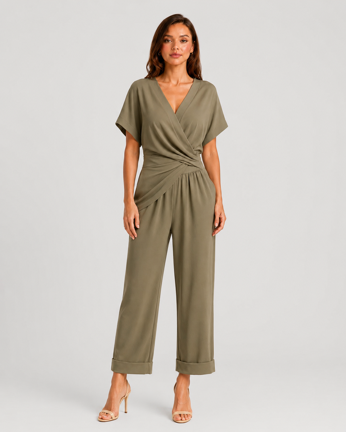 Woman wearing a lightweight wrap front co-ord set with relaxed cropped wide-leg trousers, styled for elegant summer occasions and holiday wear.